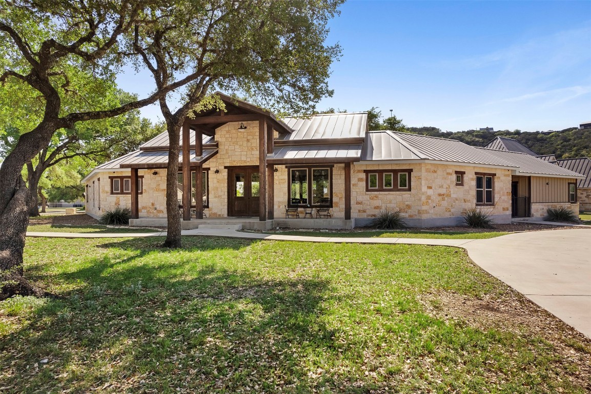 11 Stepping Stone Lane Concan, TX 78838 - Photo 4 of 47 a front view of a house with a yard