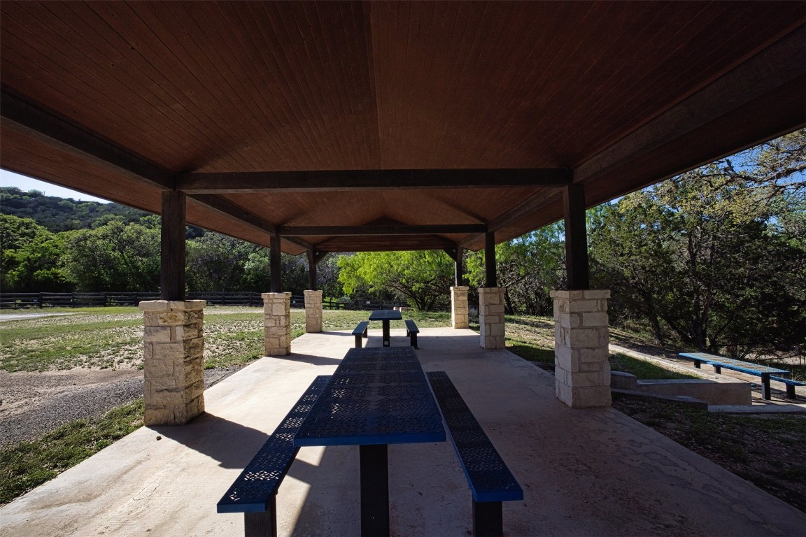 11 Stepping Stone Lane Concan, TX 78838 - Photo 41 of 47 a view of a patio with table and chairs potted plants with large tree