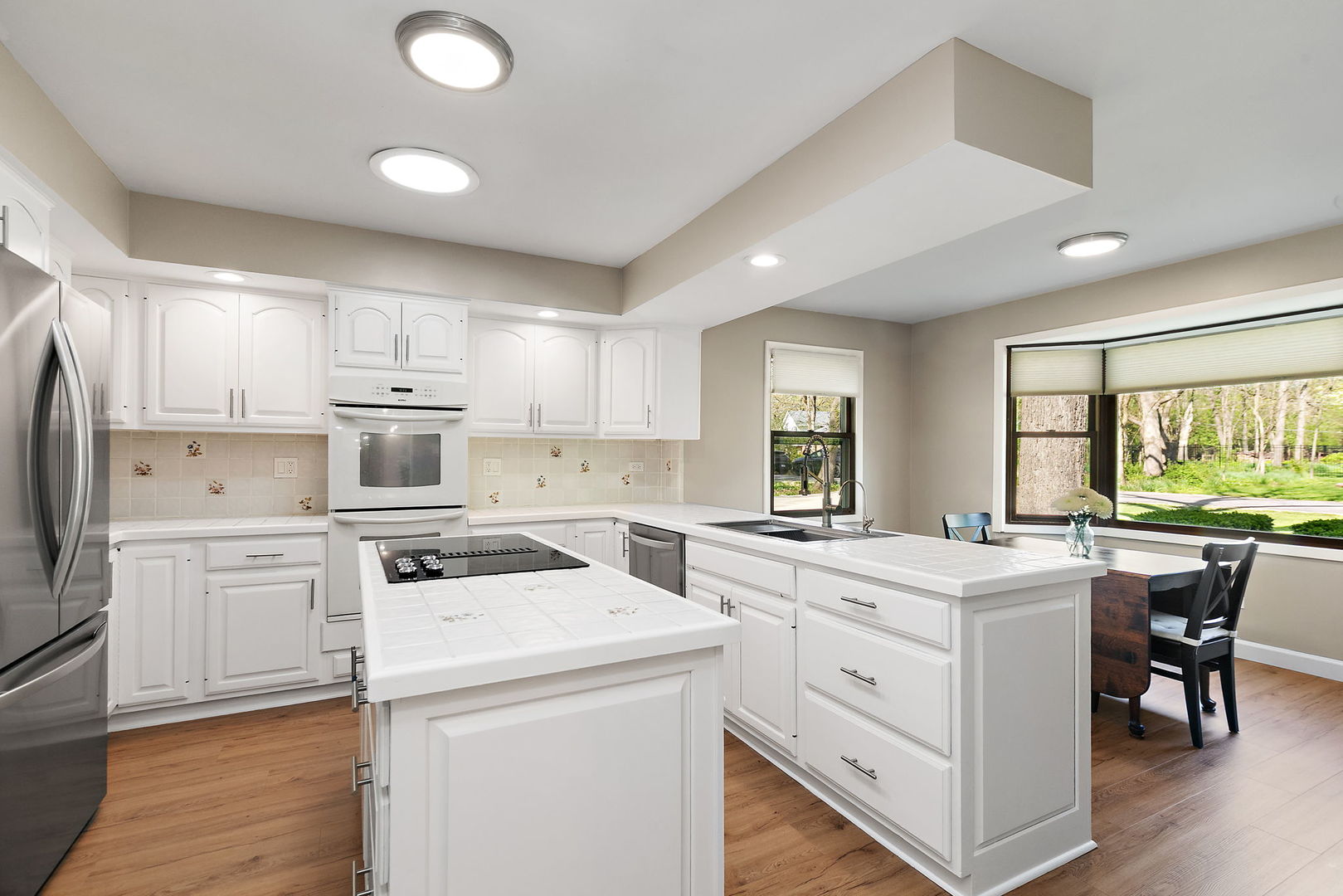 713 Council Hill Road East Dundee, IL 60118 - Photo 11 of 40 a kitchen that has a lot of white cabinets and stainless steel appliances
