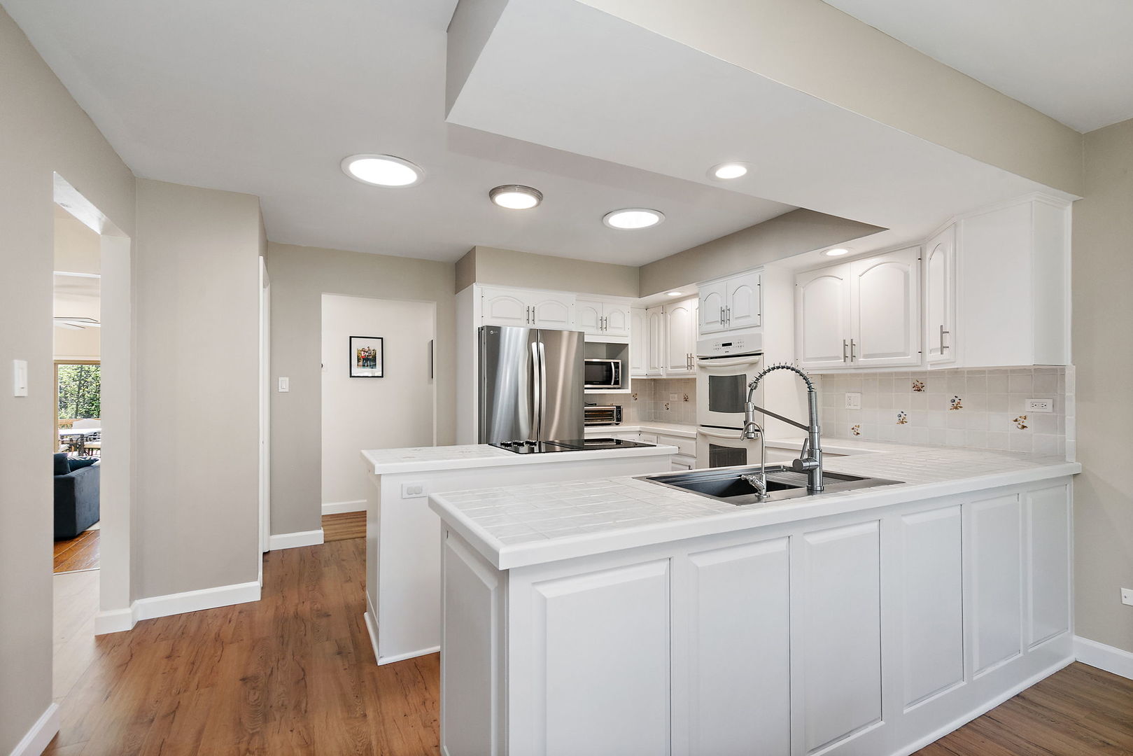 713 Council Hill Road East Dundee, IL 60118 - Photo 14 of 40 a kitchen that has a sink a refrigerator and cabinets