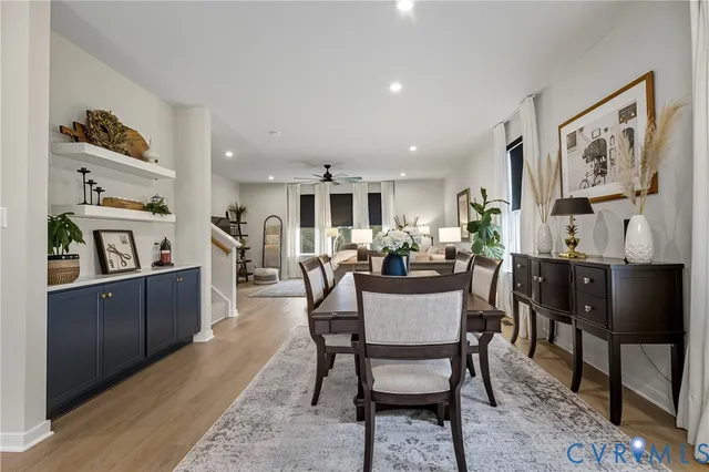 a view of a dining room with furniture and a livingroom