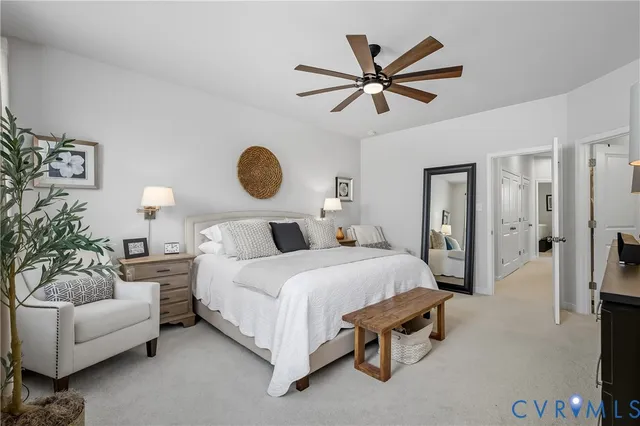 a bedroom with a bed and a couch