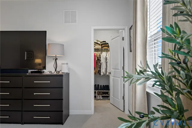 a bathroom with a double vanity sink and mirror with shower