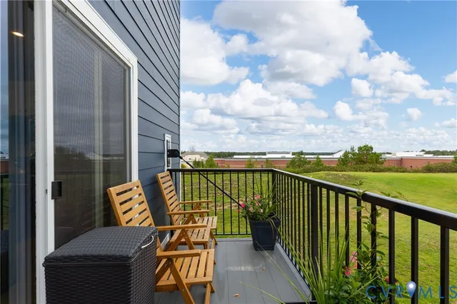 a view of balcony with furniture
