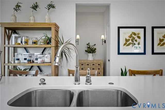 a kitchen with a sink a stove and a refrigerator