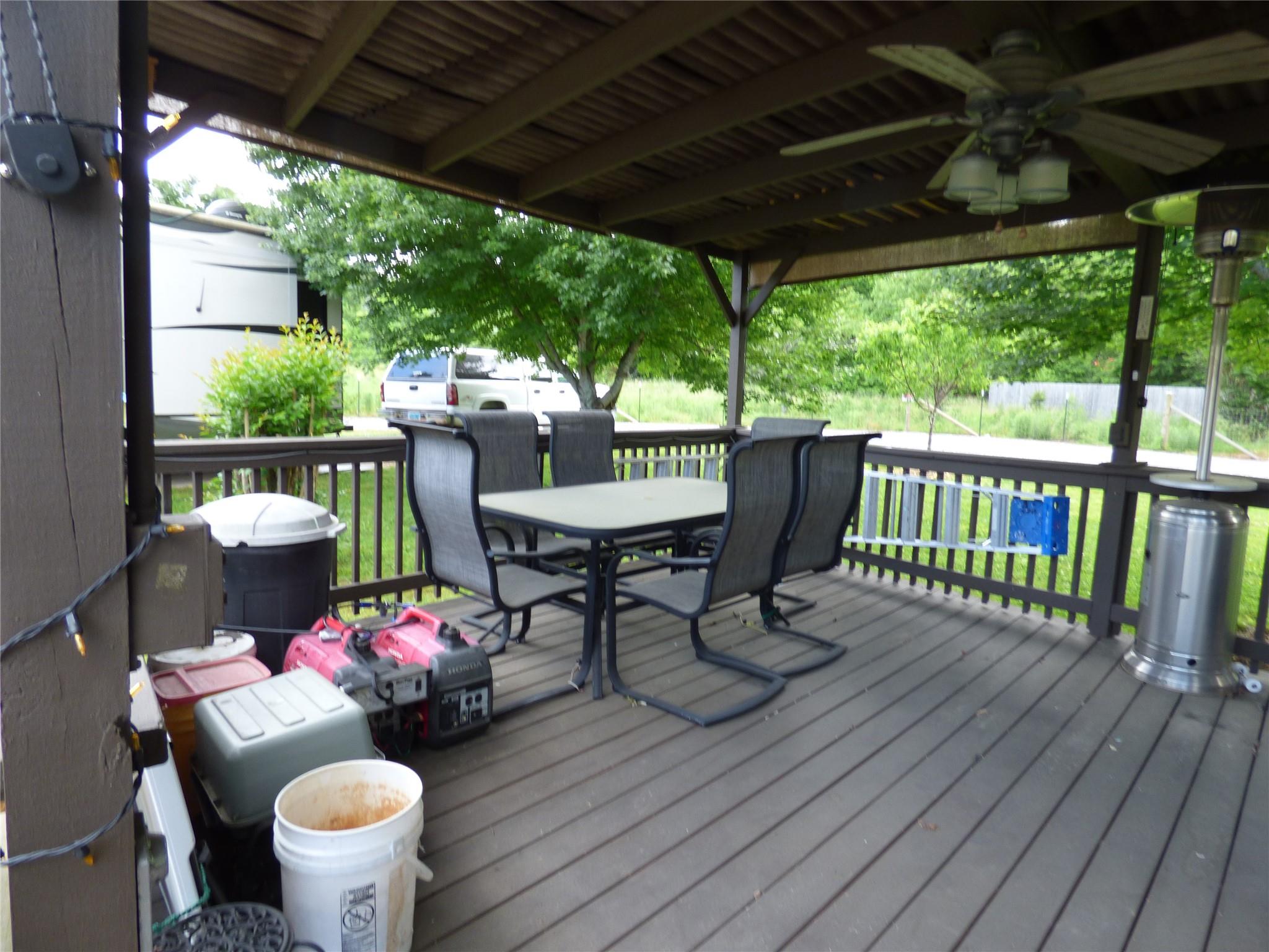 50 Timber Leaf Drive, Unit 12 Sylva, NC 28779 - Photo 12 of 14 a view of a chairs and table in patio with a barbeque grill
