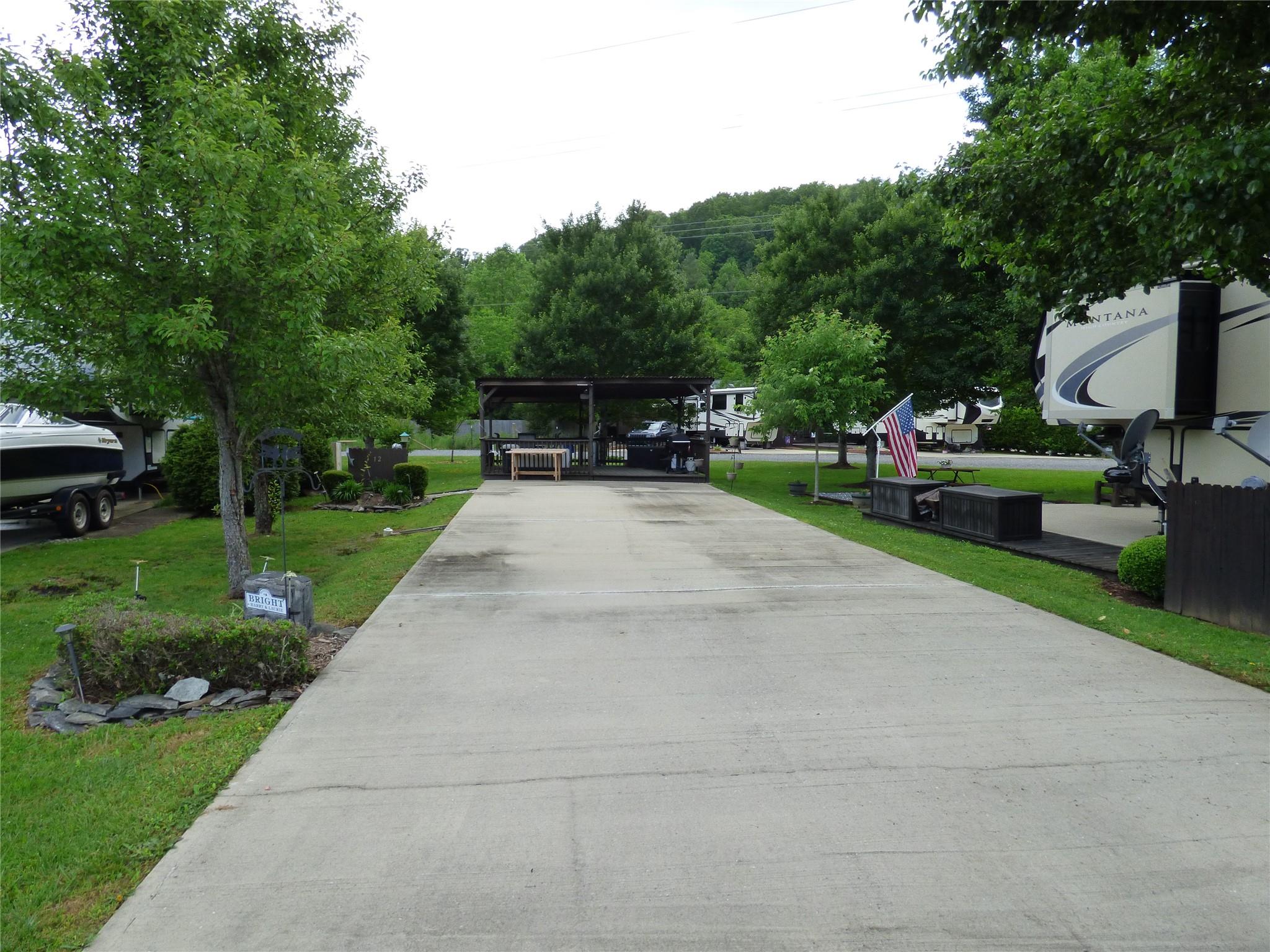 50 Timber Leaf Drive, Unit 12 Sylva, NC 28779 - Photo 7 of 14 a view of a backyard with sitting area