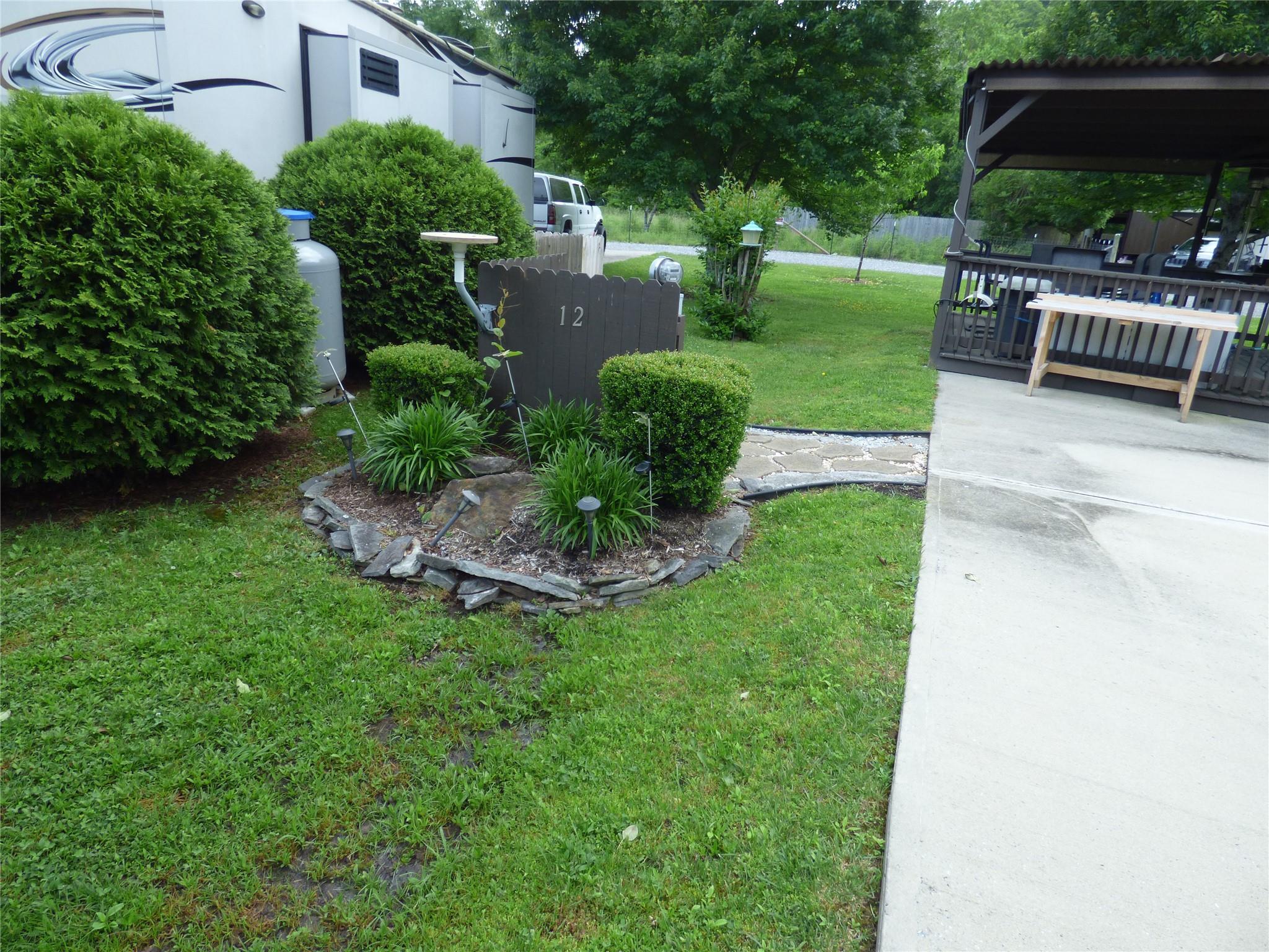 50 Timber Leaf Drive, Unit 12 Sylva, NC 28779 - Photo 8 of 14 a view of a backyard with sitting area