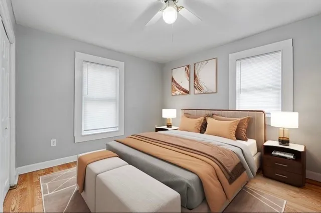 a bedroom with bed and window