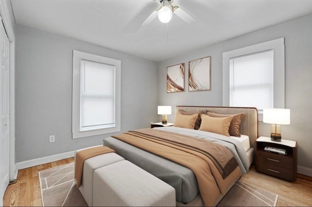 320 Cedar Street, Unit 2 Manchester, NH 03103 - Photo 4 of 5 a bedroom with bed and window