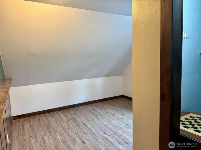 a view of front door with wooden floor