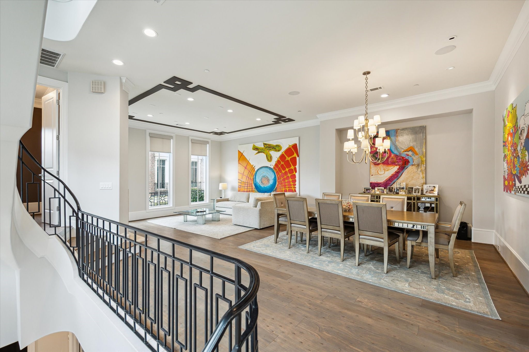 2336 Welch Street Houston, TX 77019 - Photo 12 of 39 a view of a dining room with furniture wooden floor and chandelier