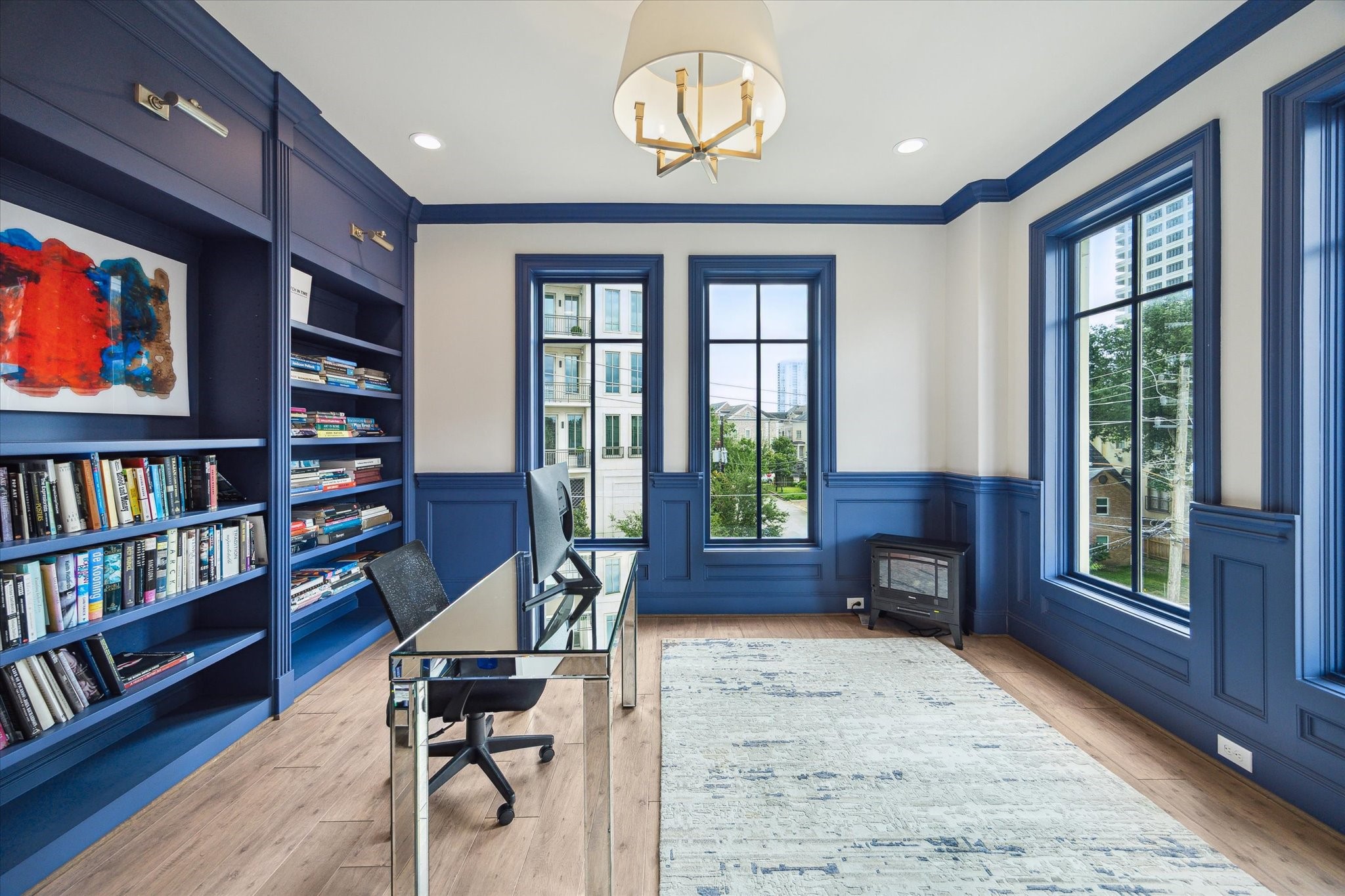 2336 Welch Street Houston, TX 77019 - Photo 14 of 39 a view of a livingroom with furniture and a bookshelf