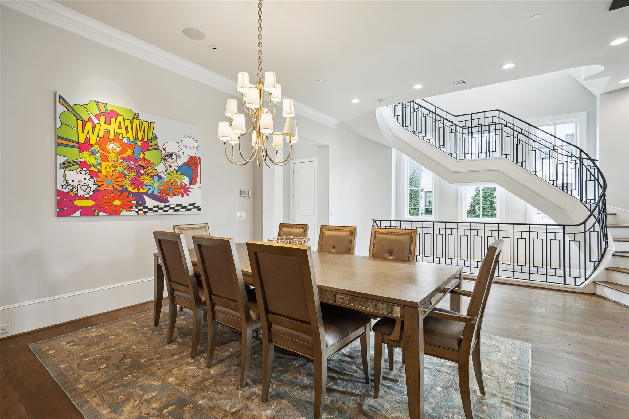 2336 Welch Street Houston, TX 77019 - Photo 16 of 39 a view of a dining room with furniture a chandelier and wooden floor