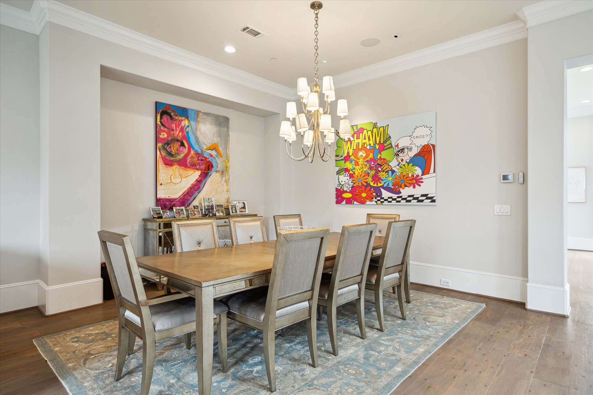2336 Welch Street Houston, TX 77019 - Photo 17 of 39 a view of a dining room with furniture a chandelier and wooden floor