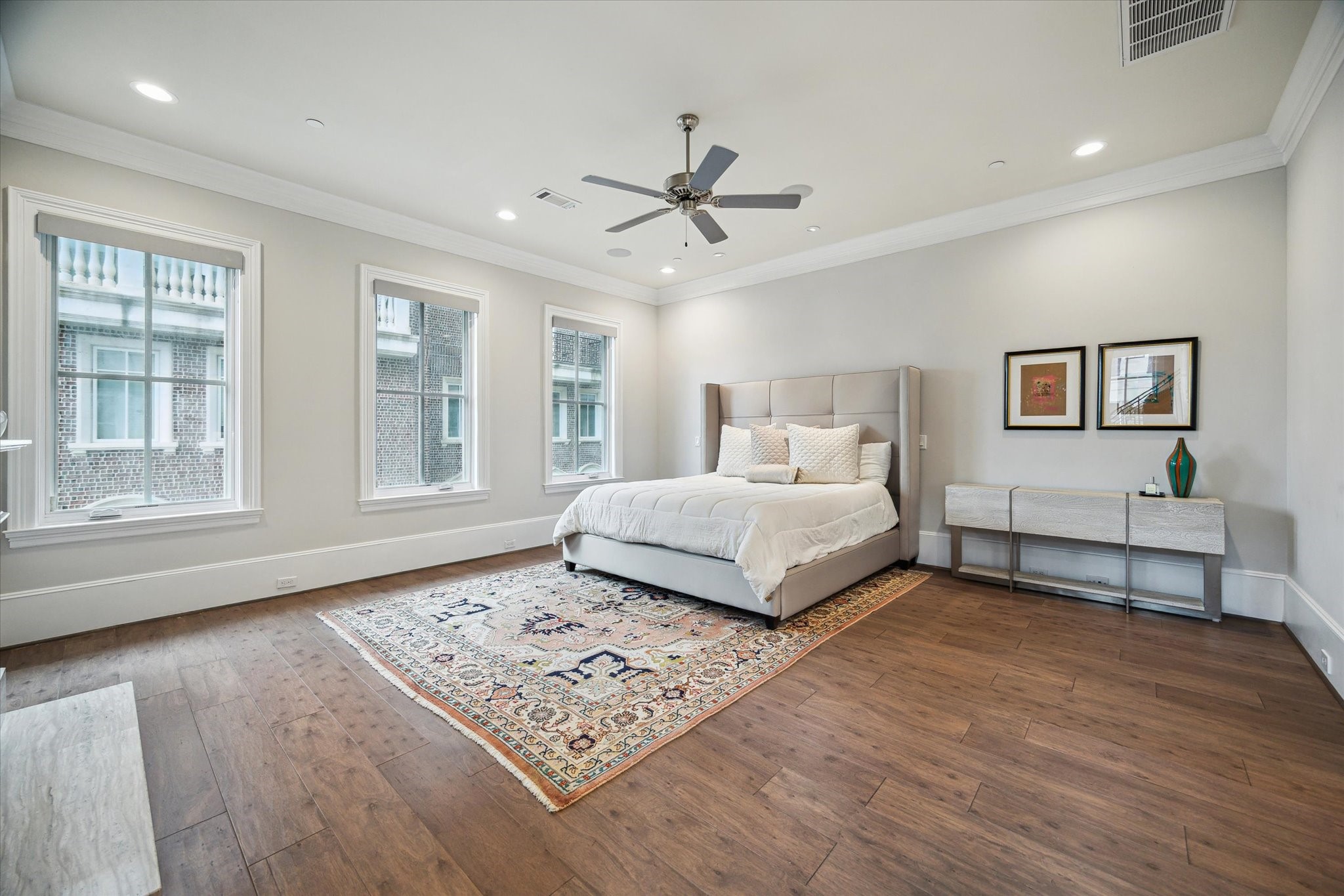 2336 Welch Street Houston, TX 77019 - Photo 25 of 39 a bedroom with a large bed and a window