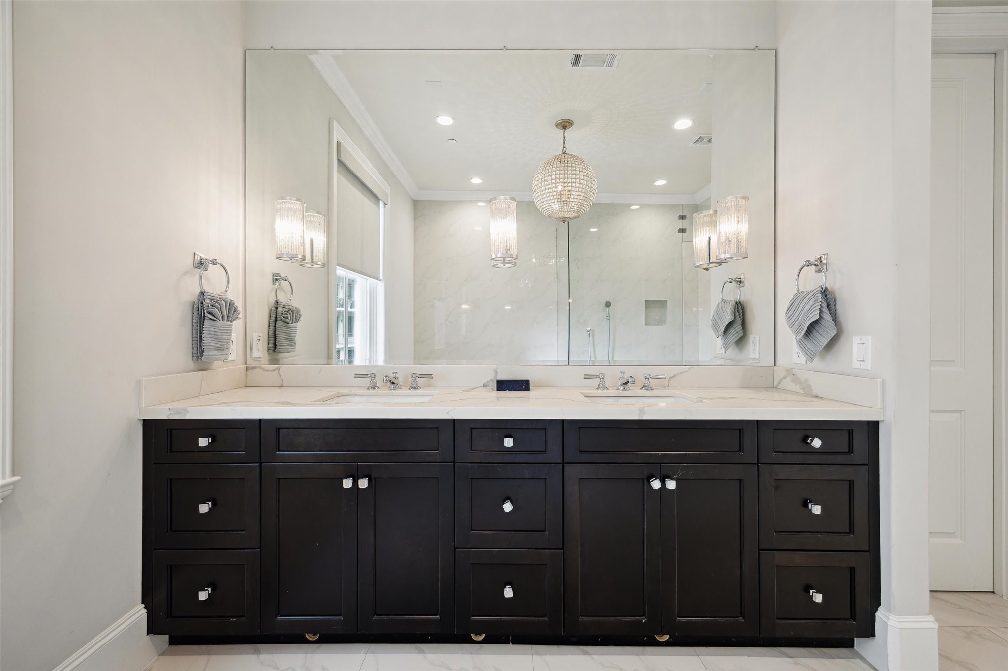 2336 Welch Street Houston, TX 77019 - Photo 28 of 39 a bathroom with a sink double vanity and a mirror