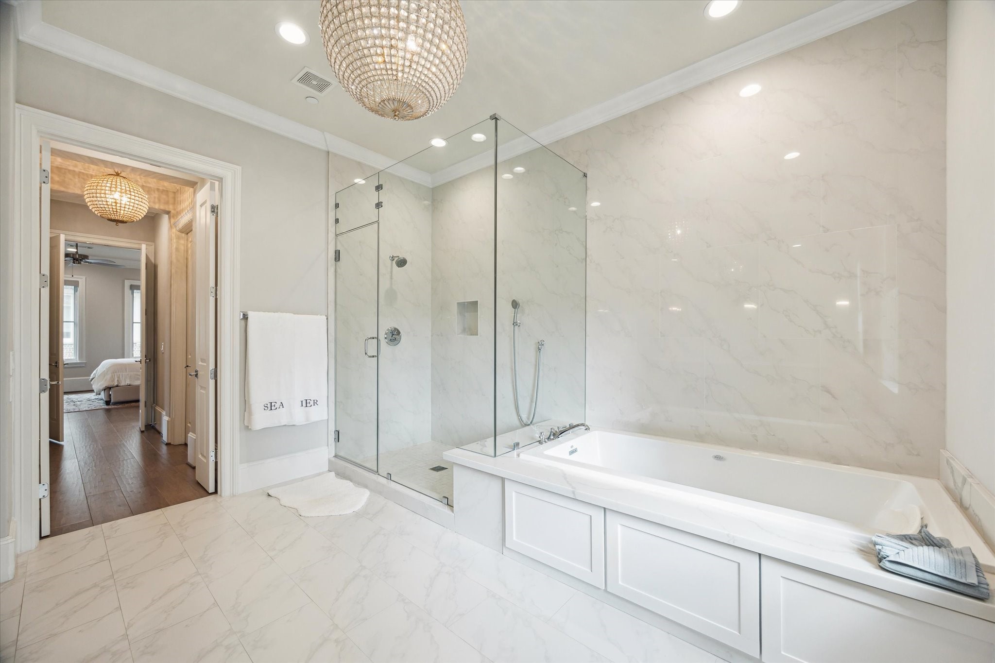 2336 Welch Street Houston, TX 77019 - Photo 29 of 39 a bathroom with a bathtub shower sink and mirror
