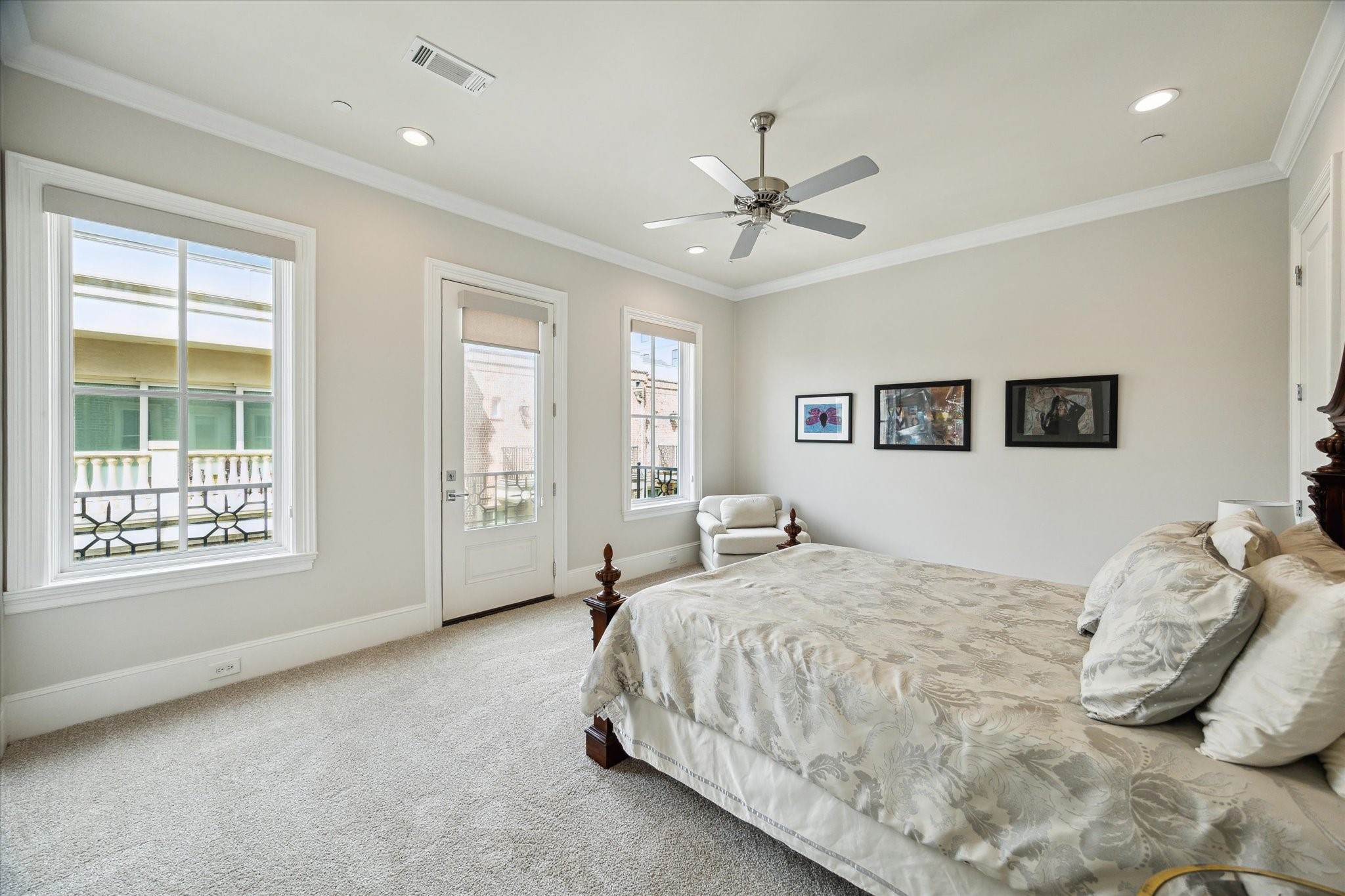 2336 Welch Street Houston, TX 77019 - Photo 30 of 39 a bedroom with a large bed and a window