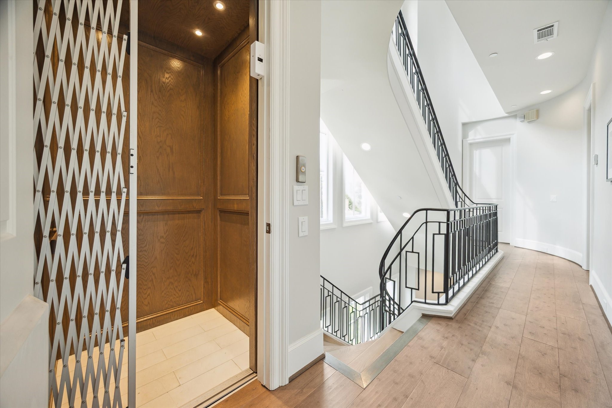 2336 Welch Street Houston, TX 77019 - Photo 33 of 39 a view of a hallway with staircase