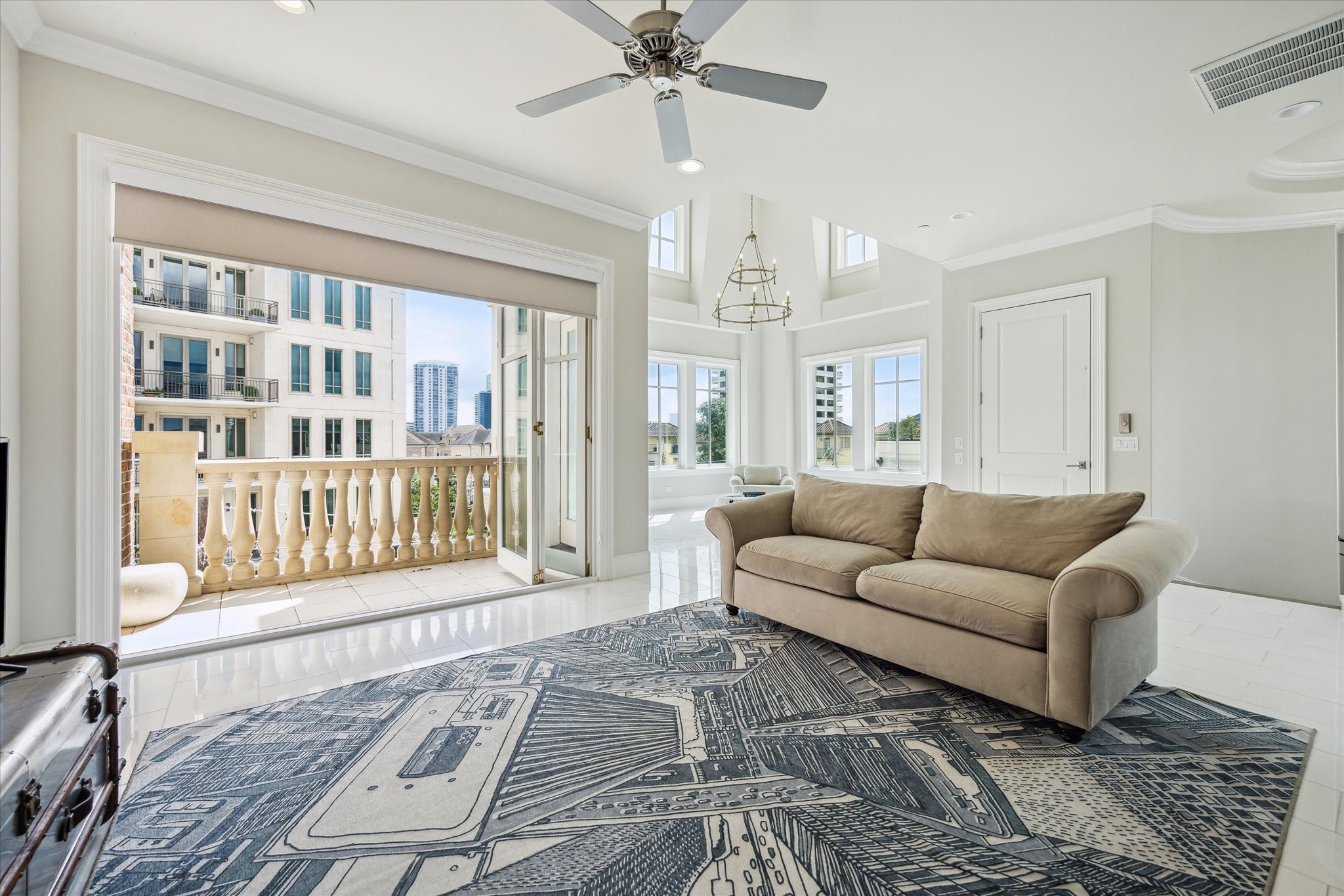 2336 Welch Street Houston, TX 77019 - Photo 35 of 39 a living room with furniture and a rug with wooden floor