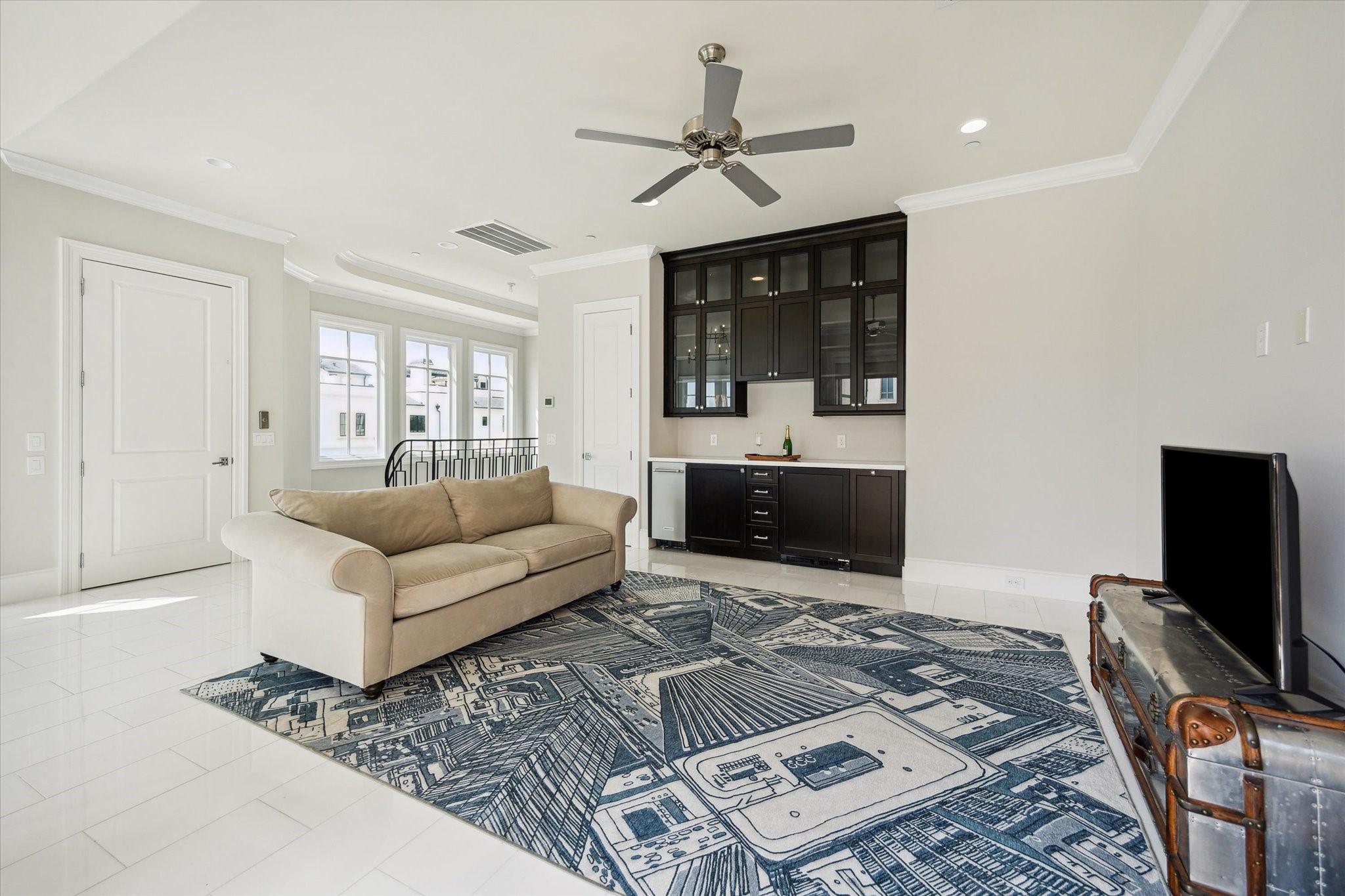 2336 Welch Street Houston, TX 77019 - Photo 36 of 39 a living room with furniture a flat screen tv and a fireplace