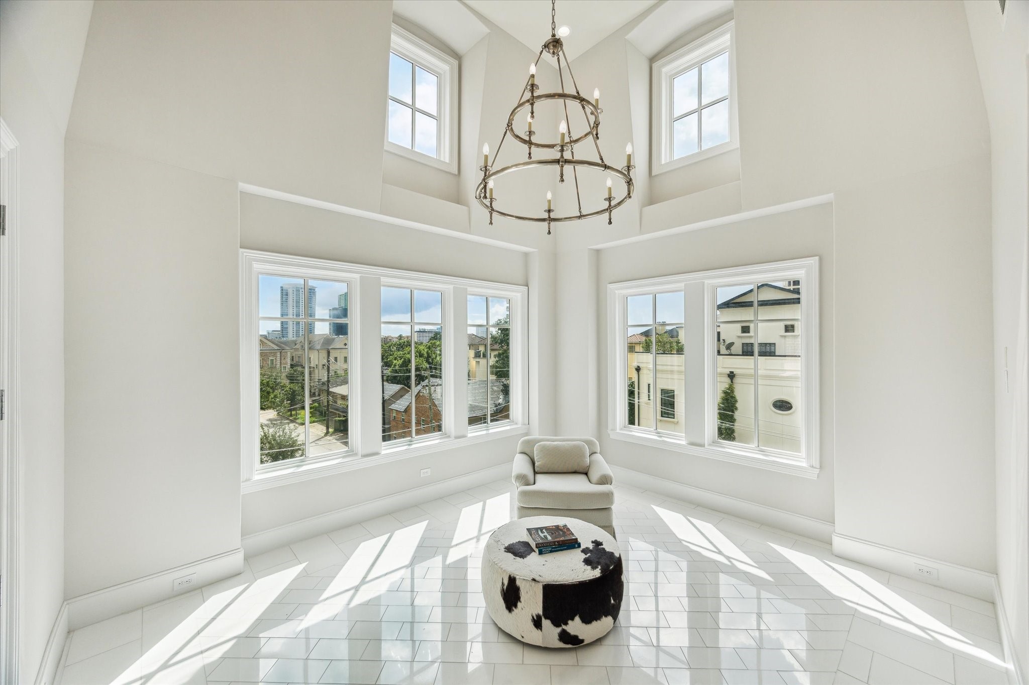 2336 Welch Street Houston, TX 77019 - Photo 37 of 39 a view of a dining room with furniture large windows and wooden floor