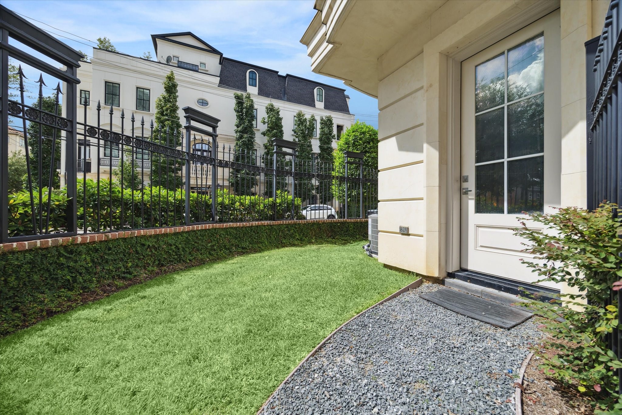 2336 Welch Street Houston, TX 77019 - Photo 6 of 39 a front view of a house with a yard