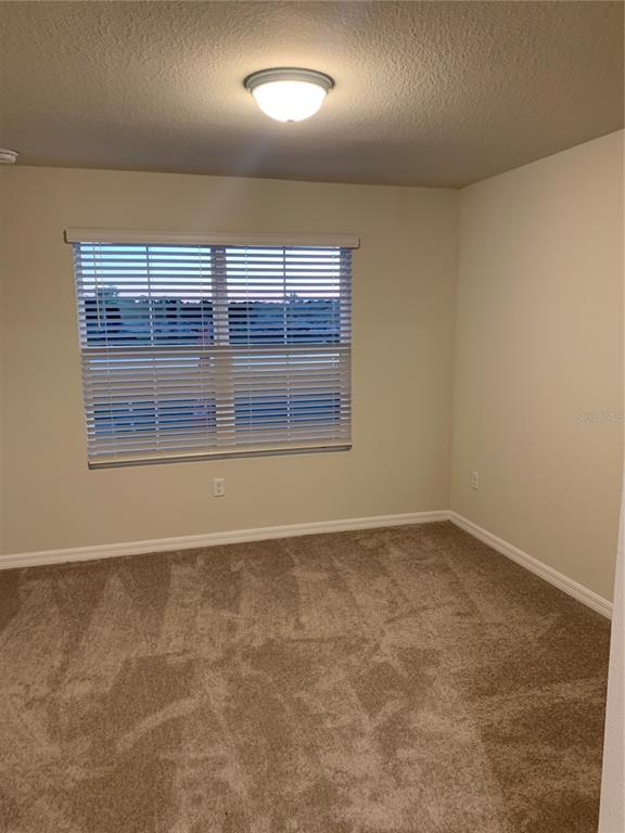 2563 Buena View Road Kissimmee, FL 34746 - Photo 11 of 15 an empty room with a empty space