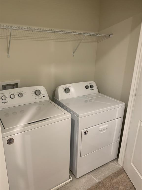 2563 Buena View Road Kissimmee, FL 34746 - Photo 15 of 15 a utility room with dryer and washer