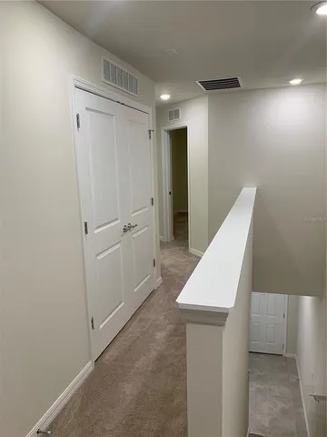 a view of an empty room with a fireplace