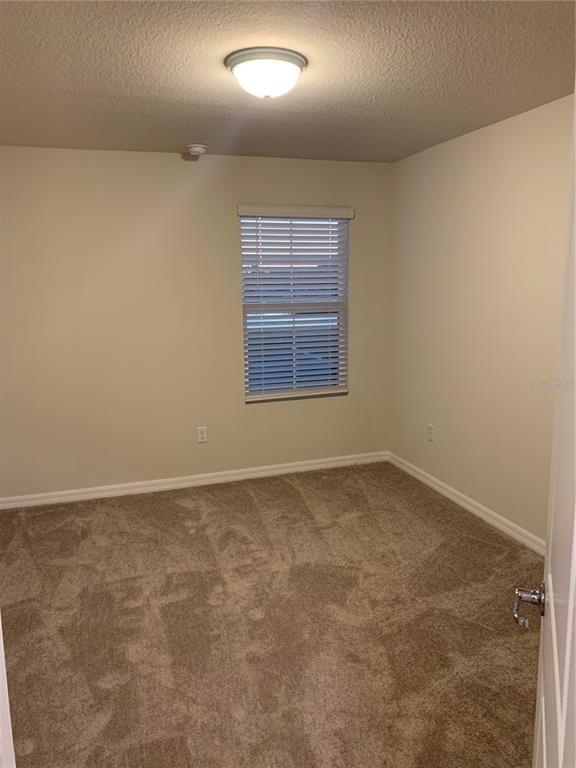 2563 Buena View Road Kissimmee, FL 34746 - Photo 9 of 15 an empty room with a window