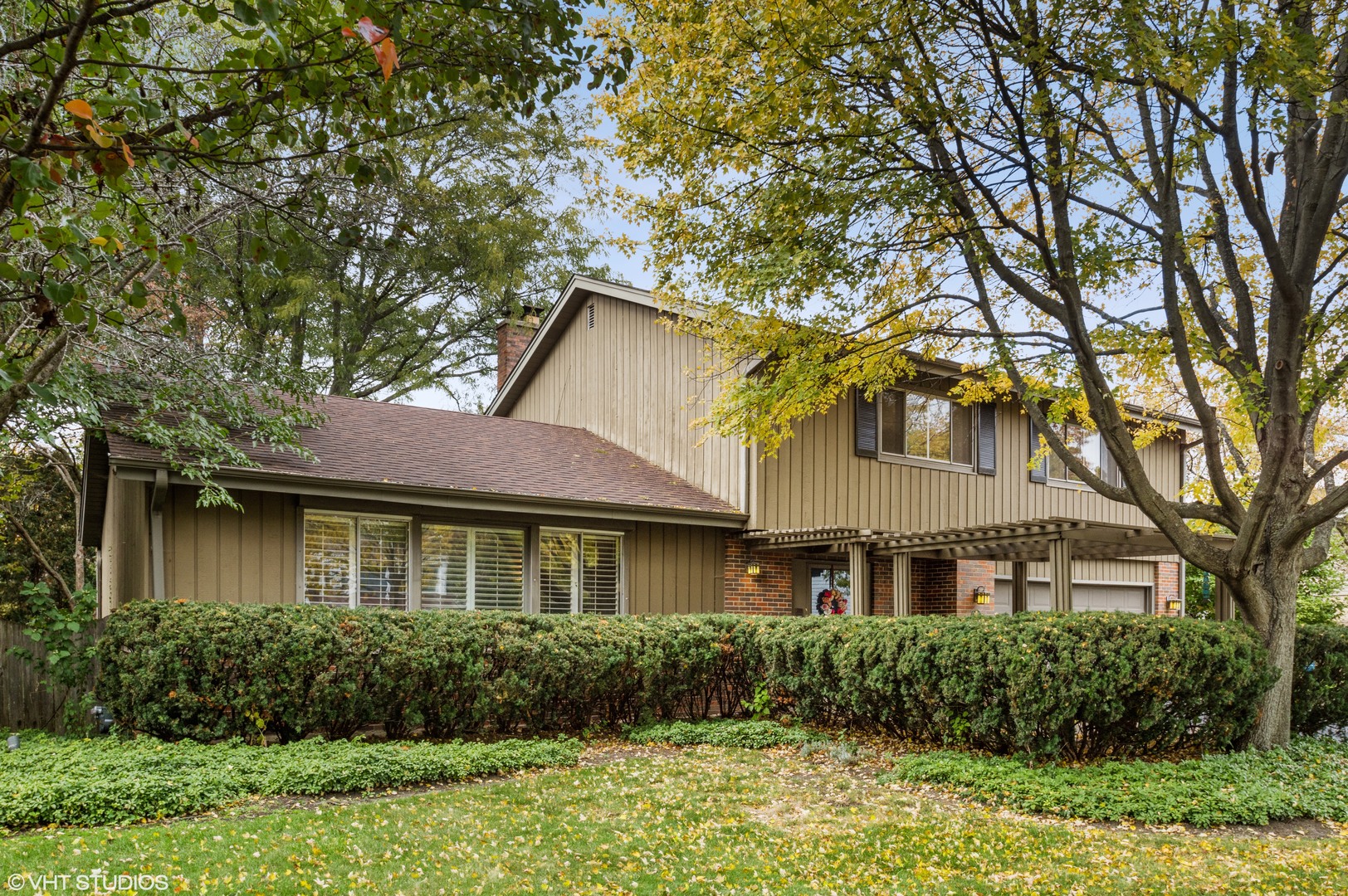 1734 Birch Road Northbrook, IL 60062 - Photo 1 of 27 a front view of a house with garden