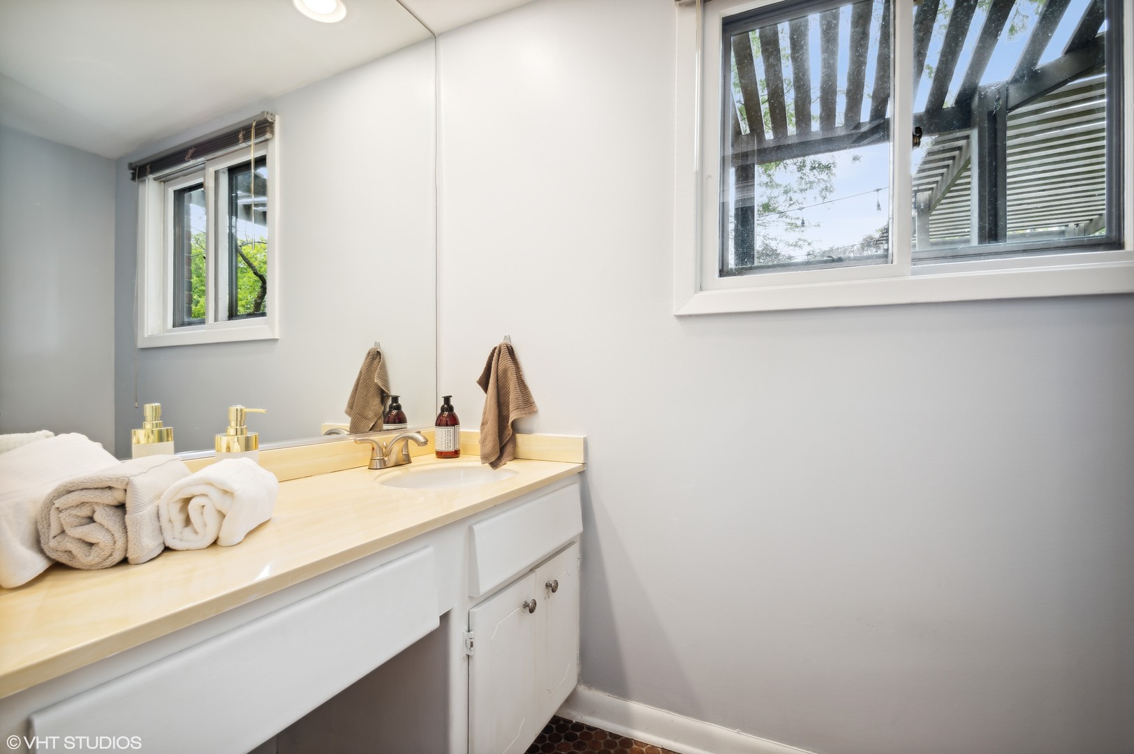 1734 Birch Road Northbrook, IL 60062 - Photo 20 of 27 a bathroom with a sink and a window