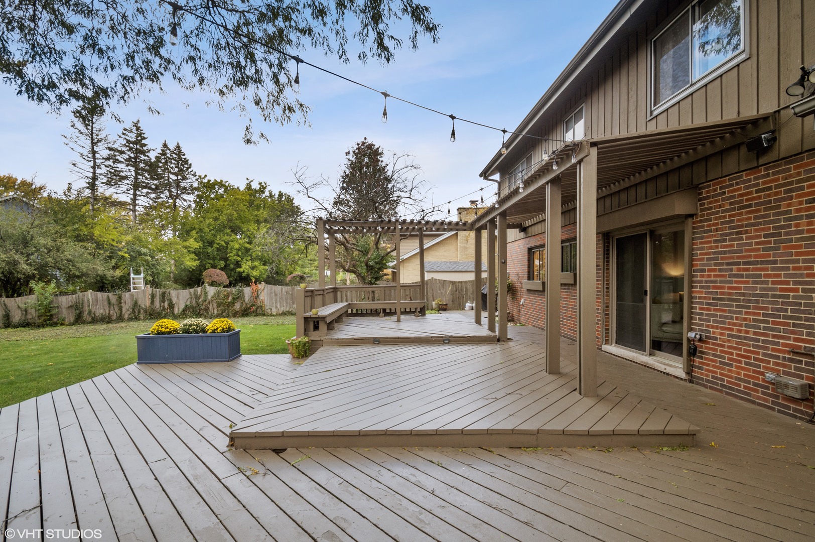 1734 Birch Road Northbrook, IL 60062 - Photo 21 of 27 a view of a patio with dining table and chairs with wooden floor and fence