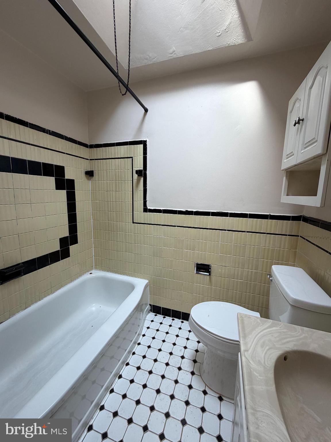 7 West 21st Street Chester, PA 19013 - Photo 11 of 18 a bathroom with a sink toilet and shower
