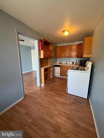 a kitchen with stainless steel appliances a refrigerator and a stove top oven