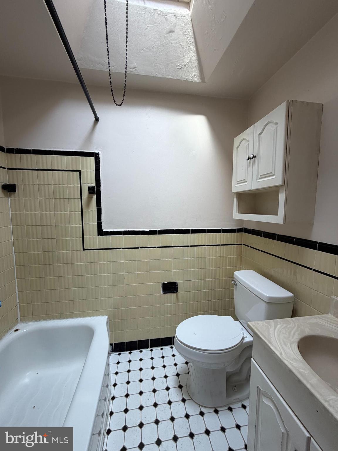7 West 21st Street Chester, PA 19013 - Photo 10 of 18 a white toilet sitting next to a bathroom sink
