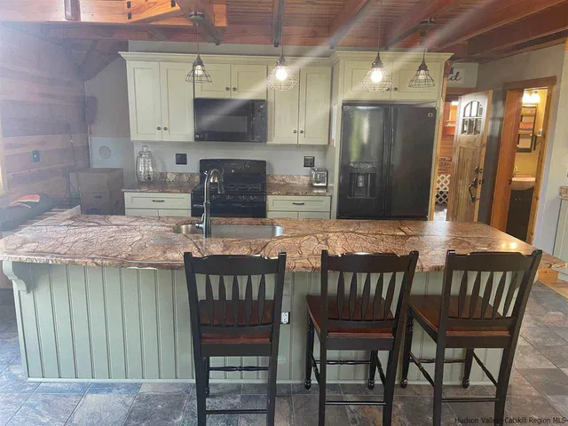 a dining room with furniture and window