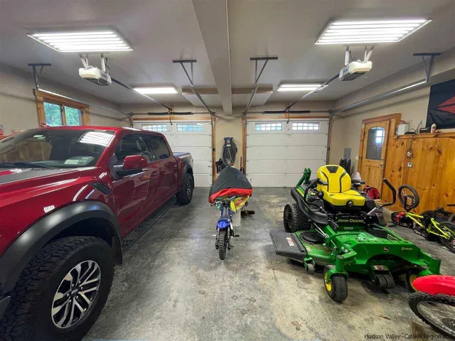 a view of parking garage with cars