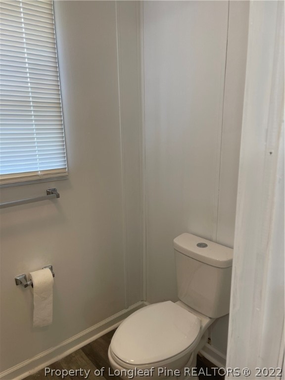 3915 Alamac Road Lumberton, NC 28358 - Photo 14 of 18 a white toilet sitting next to a window
