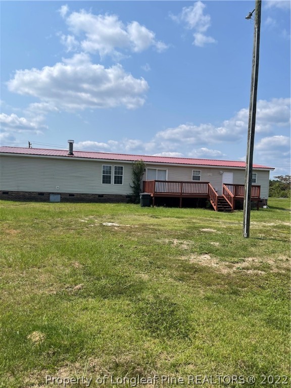 3915 Alamac Road Lumberton, NC 28358 - Photo 2 of 18 a view of pool with lawn chairs and iron fence