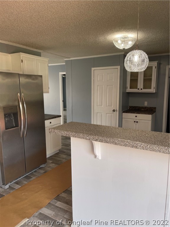 3915 Alamac Road Lumberton, NC 28358 - Photo 10 of 18 a kitchen with stainless steel appliances granite countertop a sink a refrigerator and a granite counter tops