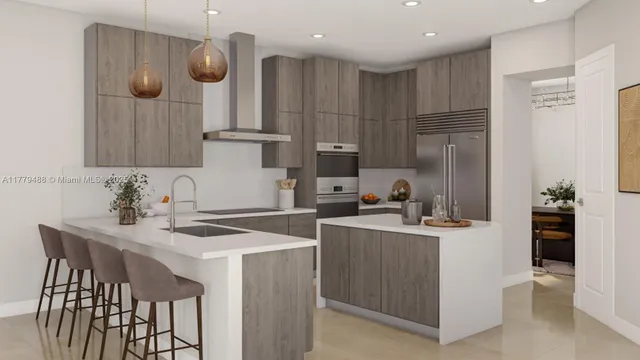 a kitchen with stainless steel appliances granite countertop a sink a stove and a refrigerator