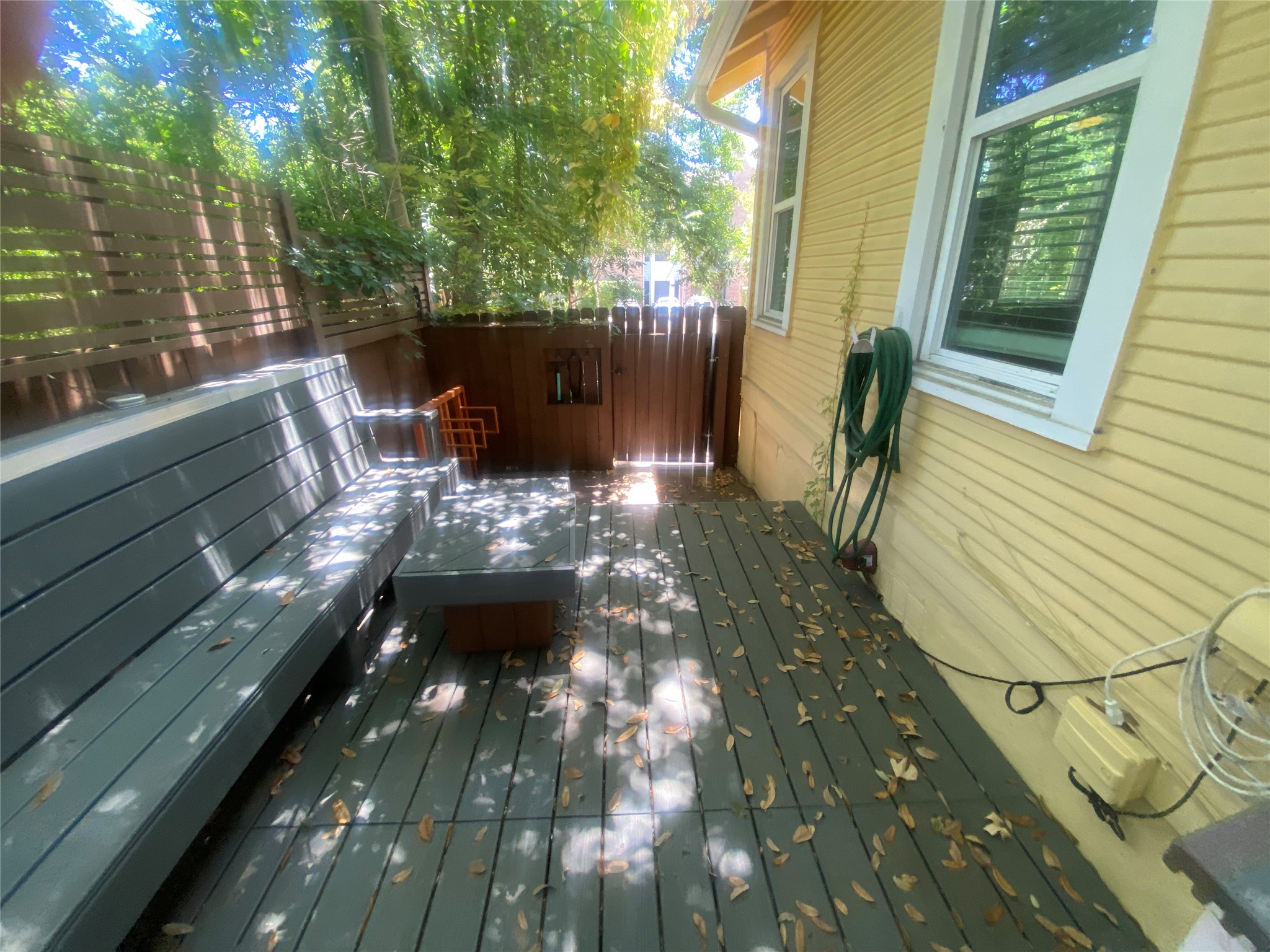 3010 Fruth Street, Unit A Austin, TX 78705 - Photo 38 of 39 An inviting deck with built-in seating offers a private outdoor retreat.