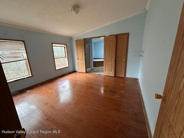70 Old Field Road New Baltimore, NY 12042 - Photo 7 of 18 a view of an empty room with window and wooden floor