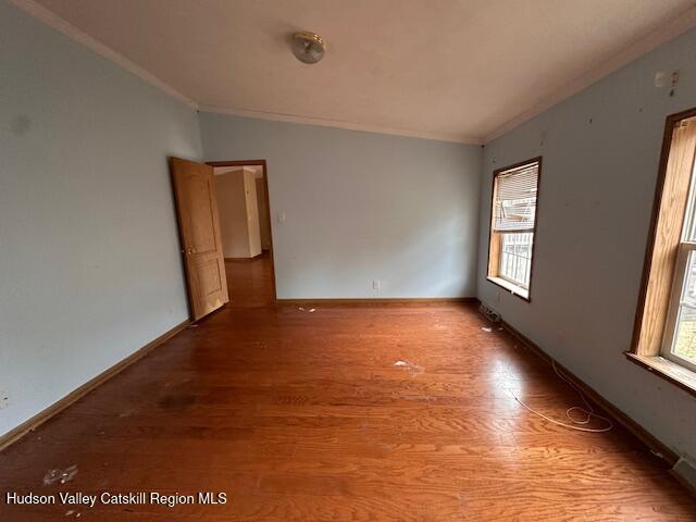 70 Old Field Road New Baltimore, NY 12042 - Photo 10 of 18 an empty room with wooden floor and windows