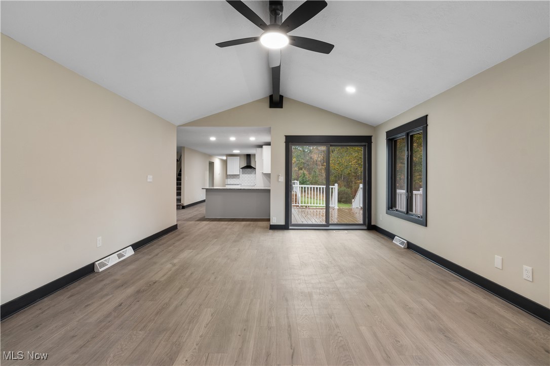 2201 Ridgewood Road Medina, OH 44256 - Photo 18 of 50 Unfurnished living room featuring light wood-style flooring, a ceiling fan, and recessed lighting