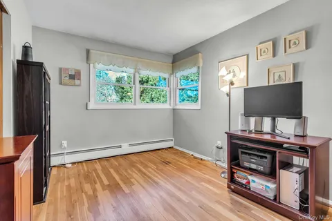 a room with furniture and a flat screen tv
