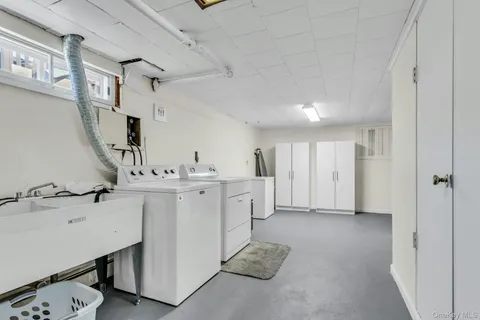 a bathroom with a sink double vanity and a mirror